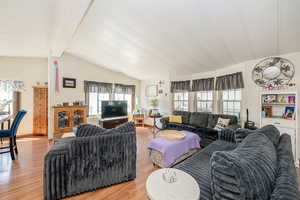 Living room with wood finished floors and baseboards