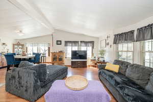Living area with plenty of natural light and wood finished floors
