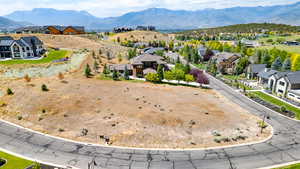 Aerial perspective of suburban area with a mountain backdrop