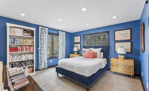 Bedroom with multiple windows, carpet floors, and recessed lighting