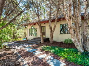 View of front facade featuring stucco siding