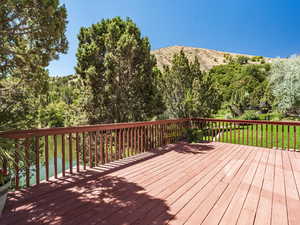 Deck featuring a lawn and a mountain view