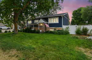 View of front of house featuring brick siding