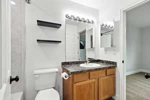 Bathroom with vanity and shower / tub combination