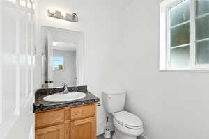 Bathroom with vanity and toilet