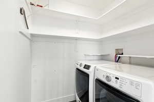 Laundry area featuring separate washer and dryer