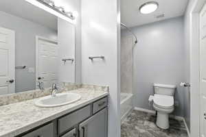 Full bathroom with vanity and  shower combination