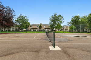 View of sport court featuring community basketball court and a tennis court