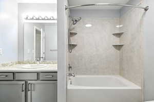 Full bathroom featuring bathtub / shower combination and vanity
