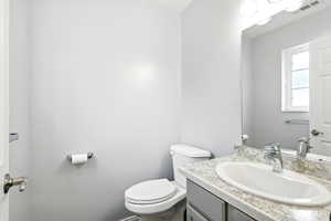 Bathroom with vanity and toilet