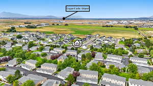 Aerial view of residential area featuring a mountainous background