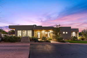 Modern home featuring stucco siding