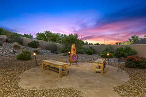 Fenced backyard with a patio