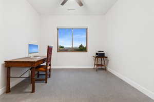 Office area featuring light colored carpet and a ceiling fan