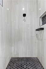 Full bathroom featuring tiled shower