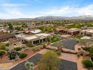 Aerial perspective of suburban area featuring a mountain backdrop
