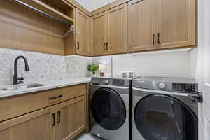 Laundry room featuring cabinet space and washing machine and clothes dryer