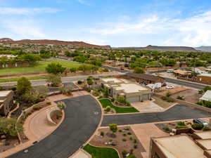Aerial view of residential area featuring a mountainous background