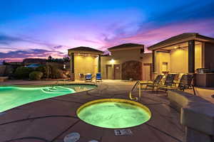 View of pool with a hot tub, a patio, and ceiling fan