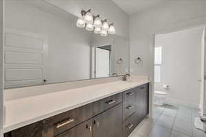 Bathroom with vanity and light tile patterned flooring
