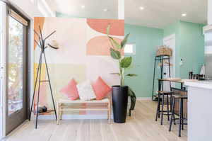 Sitting room featuring light wood-style floors and recessed lighting