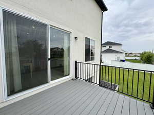 Deck featuring a lawn and a water view