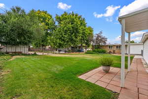 View of yard with a patio