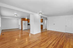 Unfurnished living room with light wood finished floors