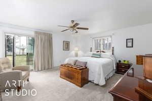 Primary Bedroom featuring access to outside, carpet, and ceiling fan