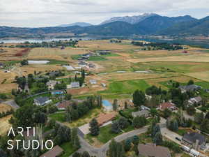 Overview of rural landscape featuring a water and mountain view