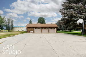 Garage featuring concrete driveway