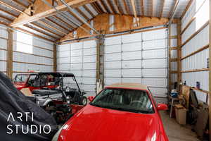 Garage featuring metal wall