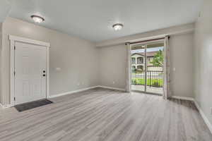 Unfurnished room featuring light wood finished floors