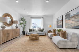 Sitting room featuring light wood finished floors and recessed lighting