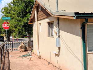 View of side of property featuring stucco siding