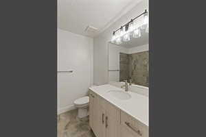 Full bathroom featuring vanity and a textured ceiling