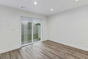 Empty room featuring recessed lighting and light wood-style floors