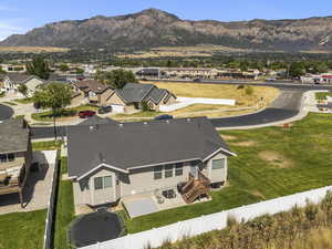 Aerial view of residential area featuring a mountainous background