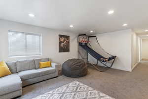 Living room with carpet and recessed lighting
