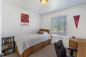 Carpeted bedroom with baseboards