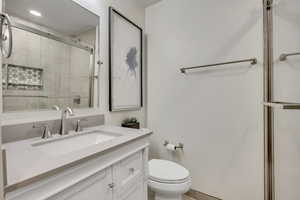 Full bath featuring vanity and a stall shower