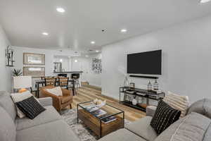 Living room featuring recessed lighting and light wood finished floors