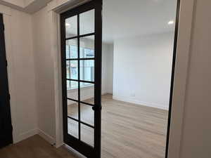 Detailed view of wood finished floors and a textured ceiling