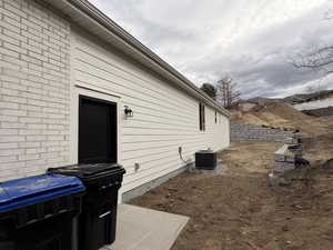 View of side of home featuring brick siding