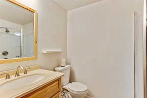 Full bath featuring vanity and a shower with shower door