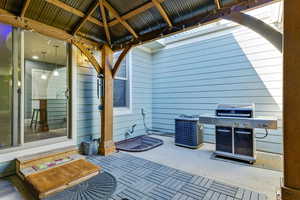 View of patio / terrace with area for grilling and a gazebo