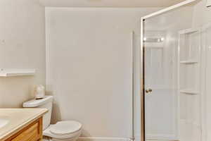 Bathroom with vanity and a shower stall