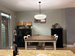 Dining room featuring baseboards and wood finished floors