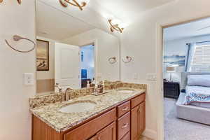 Full bath with ensuite bathroom and double vanity