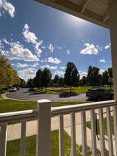 View of grassy yard featuring a playground